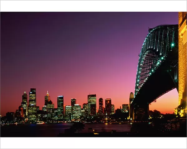 Australia, New South Wales, Sydney Harbour Bridge and city at dusk