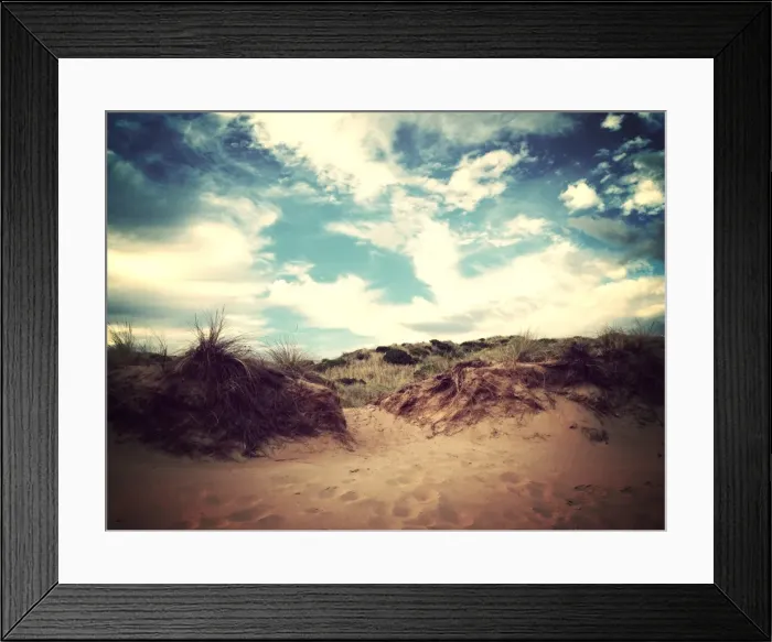 Framed Print : Footprints in the sand leading over a sand dune Framed Print : Footprints in the sand leading over a sand dune