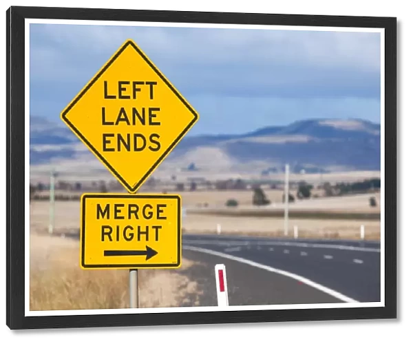 Left lane ends and merge right sign. Tasmania