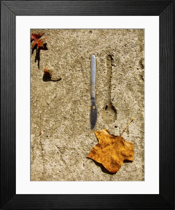 Framed Print : Knife embedded in concrete with spoon imprint