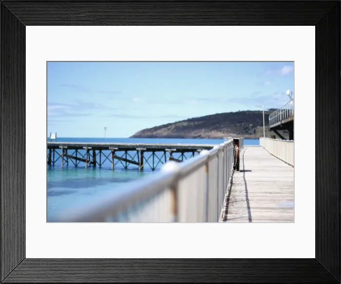 Framed Print : Old wharf with clear sky and calm ocean