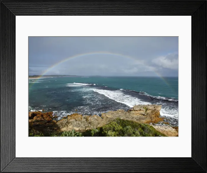 Framed Print : Rainbow over coast and ocean. Australia