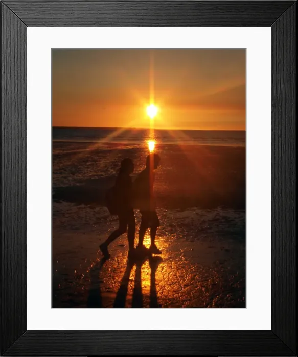 Framed Print : Couple on beach at sunset Framed Print : Couple on beach at sunset