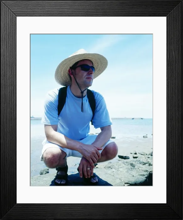 Framed Print : Man with sunhat on beach in Queensland, Australia