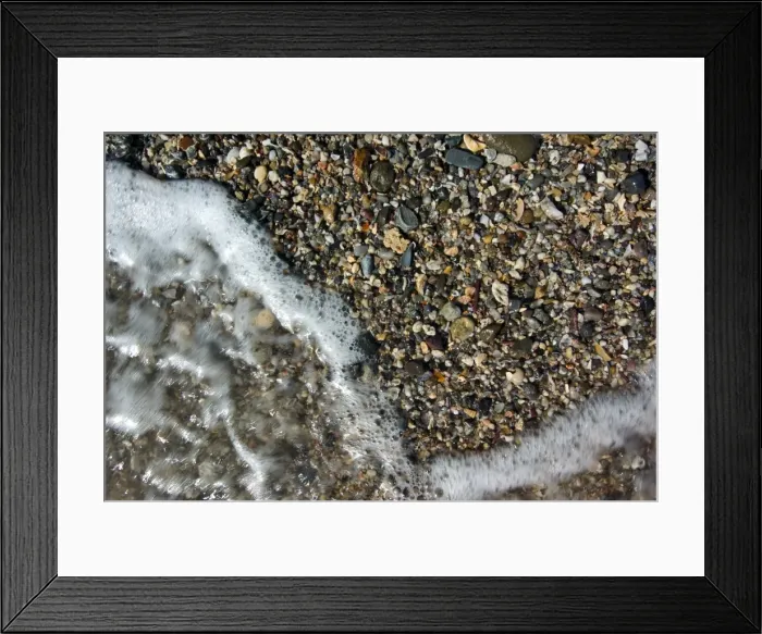 Framed Print : Foam. Shells and pebbles on beach in Mooloolaba