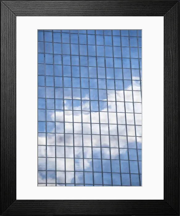 Framed Print : Clouds and sky reflected in mirrored windows of an office building Framed Print : Clouds and sky reflected in mirrored windows of an office building