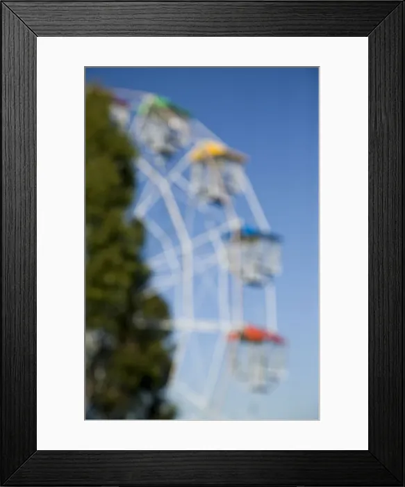 Framed Print : Blurred view of a ferris wheel Framed Print : Blurred view of a ferris wheel