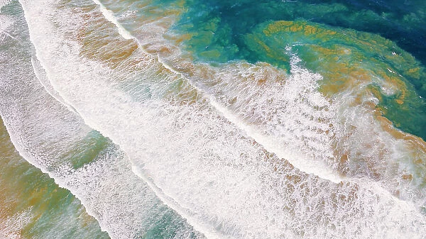 Abstract drone view of waves breaking