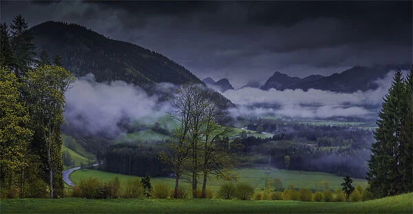 The Admont Valley in spring, with farmland pastures and mountain views, central Austria