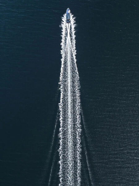Aerial image of a speed boat moving quickly across the ocean, Hong Kong
