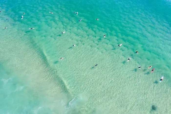 Framed Print : Aerial point of View crystal clear ocean waters with people surfing Framed Print : Aerial point of View crystal clear ocean waters with people surfing