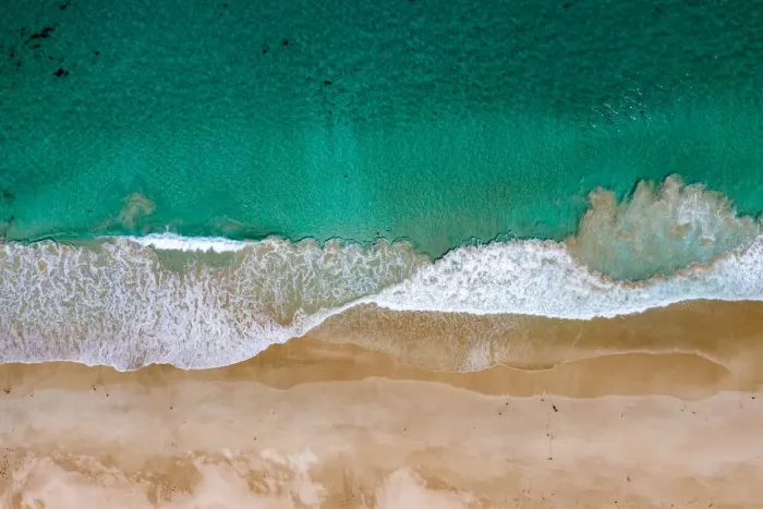 Framed Print : Aerial shot above turquoise ocean and beautiful sandy beach Framed Print : Aerial shot above turquoise ocean and beautiful sandy beach