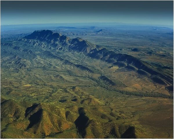 An Aerial view of the Australian outback in the Flinders Ranges, showing the vibrant colours of the Landscape