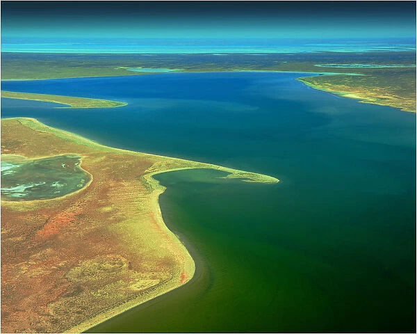 An Aerial view of the Australian outback in flood around Lake Eyre, showing the vibrant colours of the Landscape