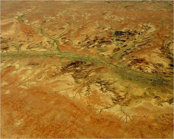 An Aerial view of the Australian outback, showing the vibrant colours of the Landscape