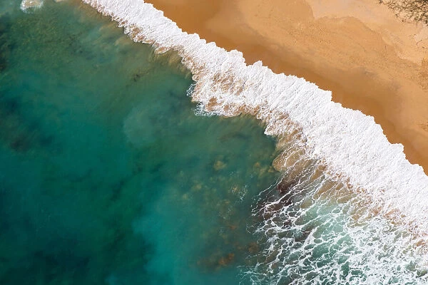 Aerial view of a beach in Caloundra, Sunshine Coast with turquoise coloured water
