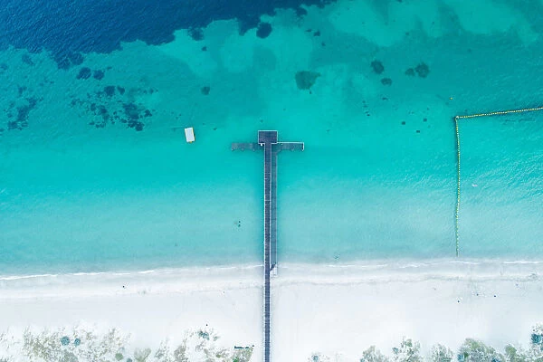 Aerial view of boat jetty on coastline