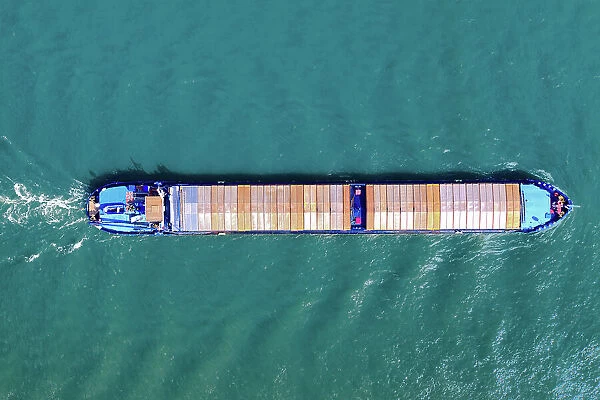 Aerial top view of a cargo container ship - transportation, import, export, logistics, commodity business in open sea