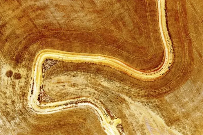 Framed Print : Aerial view of dirt road