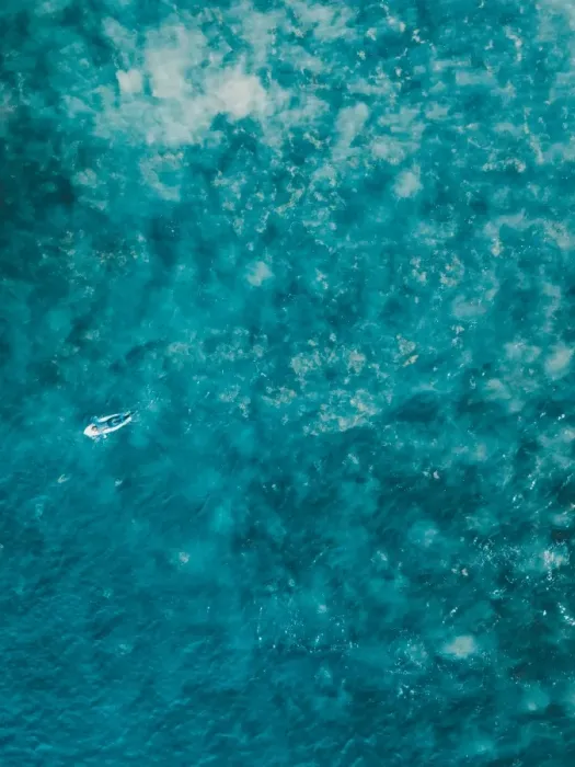 Framed Print : Aerial view of a female surfer on the ocean