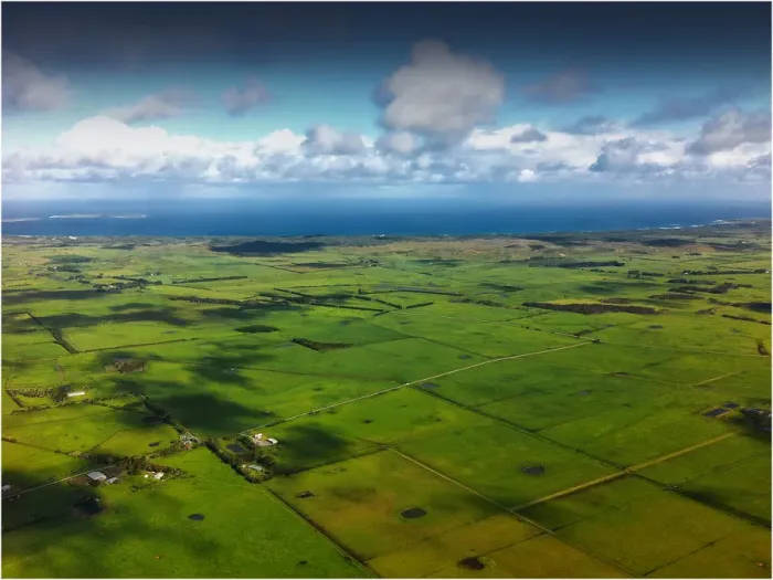 Framed Print : Aerial view of the green undulations and Bass Strait coastline, King Island, Tasmania