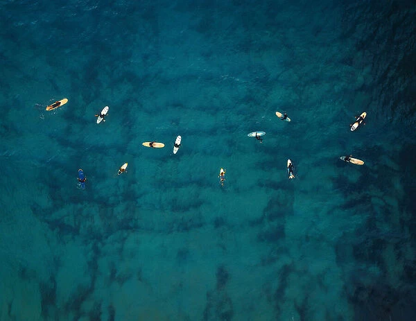 Aerial view of a group of surfers. Abstract Background