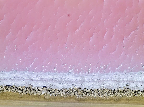 Aerial view of the natural patterns of the salty pink Lake MacDonnell in South Australia