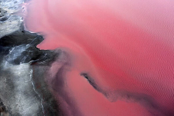 Aerial view point of the multiple colors, patterns and textures over Pink Lake waters