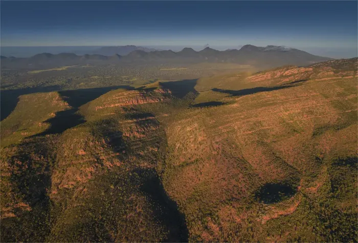 Framed Print : An aerial view of the rugged and scenically beautiful mountain ranges of Wilpena Pound in the southern region of the Flinders Ranges National Park in South Australia Framed Print : An aerial view of the rugged and scenically beautiful mountain ranges of Wilpena Pound in the southern region of the Flinders Ranges National Park in South Australia
