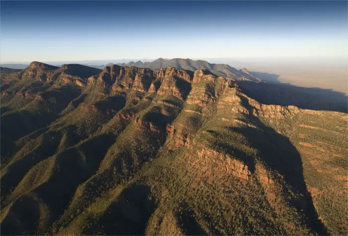 Framed Print : An aerial view of the rugged and scenically beautiful mountain ranges of Wilpena Pound in the southern region of the Flinders Ranges National Park in South Australia Framed Print : An aerial view of the rugged and scenically beautiful mountain ranges of Wilpena Pound in the southern region of the Flinders Ranges National Park in South Australia