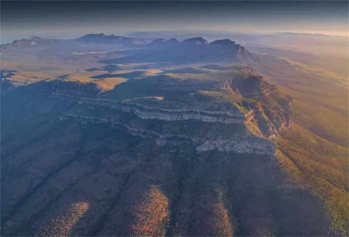 Framed Print : An aerial view of the rugged and scenically beautiful mountain ranges of Wilpena Pound in the southern region of the Flinders Ranges National Park in South Australia Framed Print : An aerial view of the rugged and scenically beautiful mountain ranges of Wilpena Pound in the southern region of the Flinders Ranges National Park in South Australia