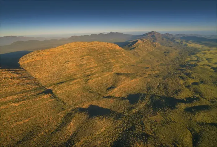 Framed Print : An aerial view of the rugged and scenically beautiful mountain ranges of Wilpena Pound in the southern region of the Flinders Ranges National Park in South Australia Framed Print : An aerial view of the rugged and scenically beautiful mountain ranges of Wilpena Pound in the southern region of the Flinders Ranges National Park in South Australia