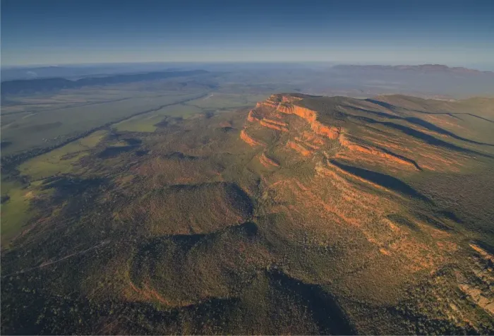 Framed Print : An aerial view of the rugged and scenically beautiful mountain ranges of Wilpena Pound in the southern region of the Flinders Ranges National Park in South Australia Framed Print : An aerial view of the rugged and scenically beautiful mountain ranges of Wilpena Pound in the southern region of the Flinders Ranges National Park in South Australia