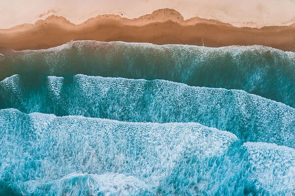 Aerial view of sea waves breaking on shore