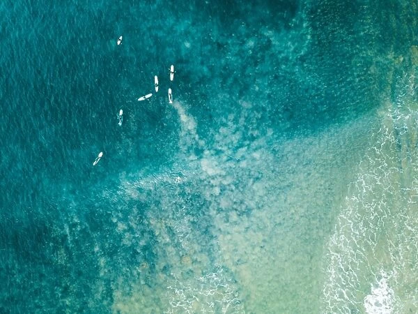 Aerial view of surfers on the ocean
