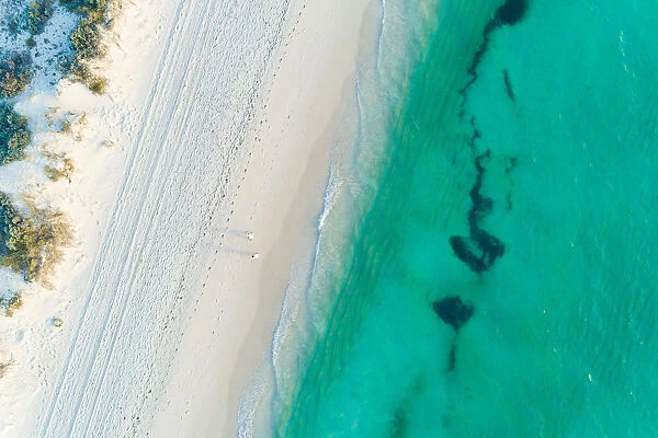 Aerial views over coastal beach scene in summer