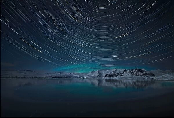 Aurora Borealis and star-trails at Jokulsarlon lagoon in winter, southern Iceland