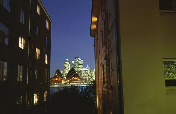 Australia, Sydney, view of opera house between apartment buildings