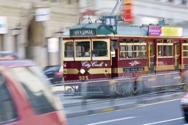 Australia, Victoria, Melbourne, streetcar (blurred motion)