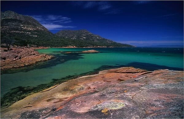 The beautiful aqua waters of honeymoon Bay on the Freycinet Peninsular, East coast of Tasmania