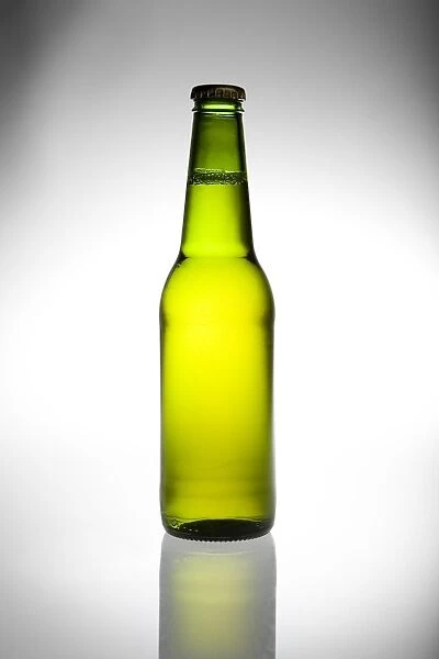 beer in green glass bottle