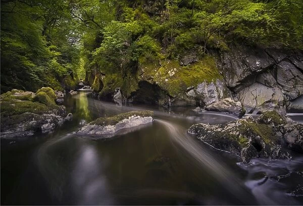 Betws-y-coed fairy glen with wonderful cascading waterfalls, rapids and fern grottos in northern Wales, United Kingdom