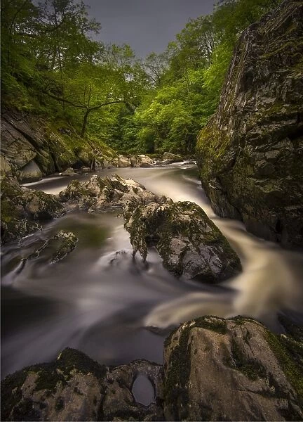 Betws-y-coed fairy glen with wonderful cascading waterfalls, rapids and fern grottos in northern Wales, United Kingdom