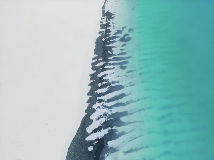Framed Print : Bizarre patterns at the edge of a remote beach photographed from an aerial point of view Framed Print : Bizarre patterns at the edge of a remote beach photographed from an aerial point of view