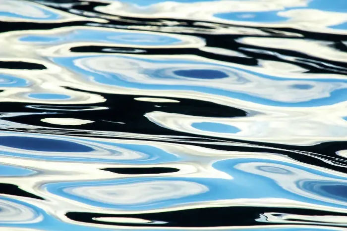 Framed Print : Blue, black and white colours reflected in the sea. Calm ocean water Framed Print : Blue, black and white colours reflected in the sea. Calm ocean water