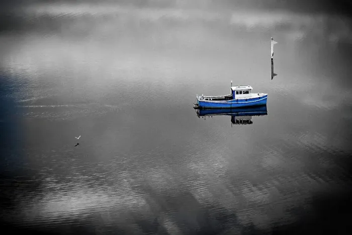 Framed Print : A Blue Boat, in Spot Colour, with a black and White treatment