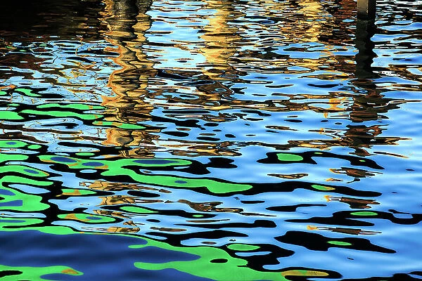 Blue and green colours reflected in the sea at the commercial dock at the Port Lincoln Wharf. Port Lincoln. South Australia