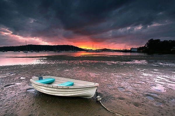 Boat on beach at sunrise