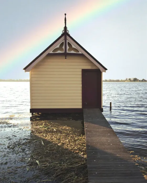 Framed Print : Boat shed with rainbow in sky