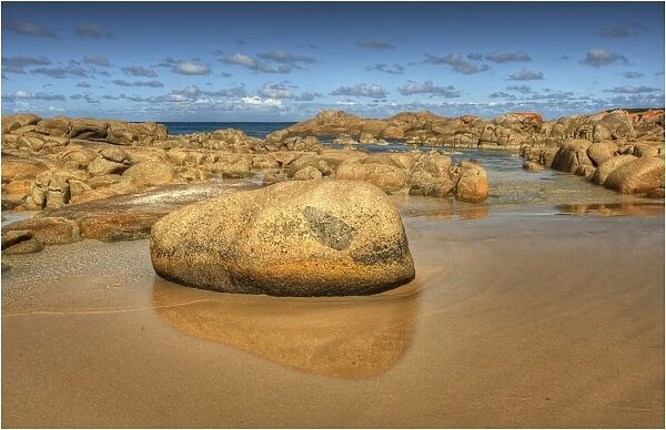 A boulder strewn beach on King Island, Bass Strait, Tasmania, Australia